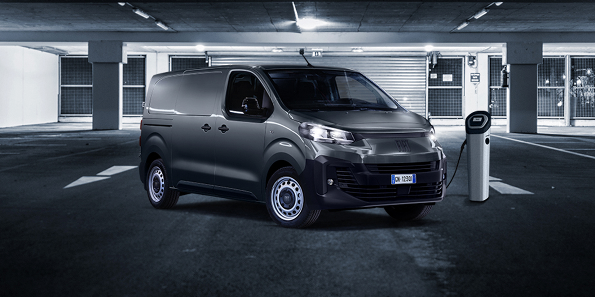 Fiat commercial vehicle parked next to charging station